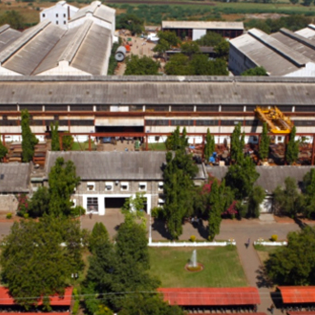 Abstract industrial illustration of early 20th century India's emerging industrial landscape